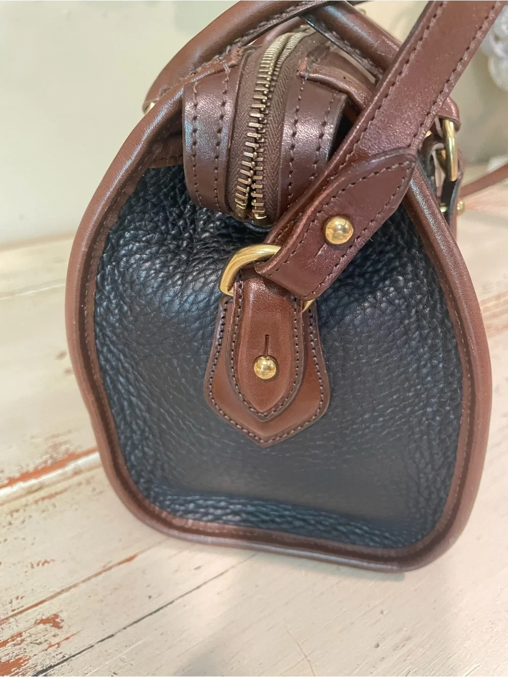 Dooney & Bourke vintage AWL Black and Brown Pebbled Leather Satchel / crossbody